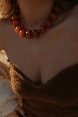 Ambarino Camel Necklace. Spark joy this season with our extra large beaded necklace in a rich camel hue.