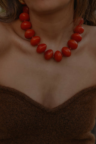 Ambarino Red Necklace. Spark joy this season with our extra large beaded necklace in a rich red hue.