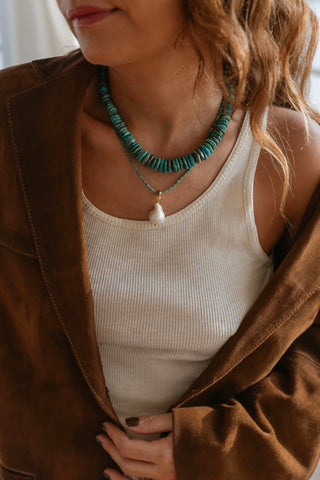 Elevate your accessory game with this handmade necklace crafted from a beautiful array of graduated turquoise beads.