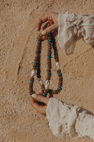 Candy Necklace in khaki. A favorite of the season crafted with green glass beads and two large baroque freshwater pearls.