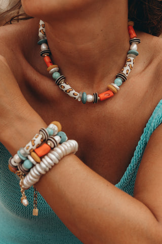 Leo Necklace, a chunky piece handcrafted with freshwater pearls and colorful beads. Wear it solo or layer it with other necklaces for a statement look.