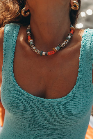 Leo Necklace, a chunky piece handcrafted with freshwater pearls and colorful beads. Wear it solo or layer it with other necklaces for a statement look.