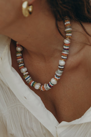 Fleurs Necklace brings a twist to the classic pearl necklace adding recycled floral glass beads for a colorful and chic touch.