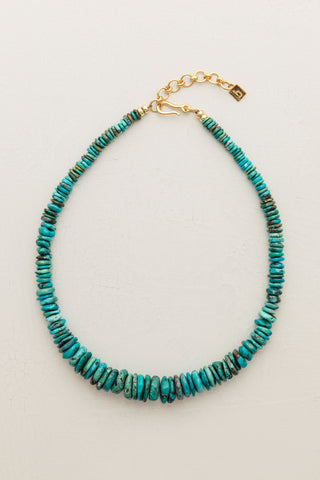 Elevate your accessory game with this handmade necklace crafted from a beautiful array of graduated turquoise beads.